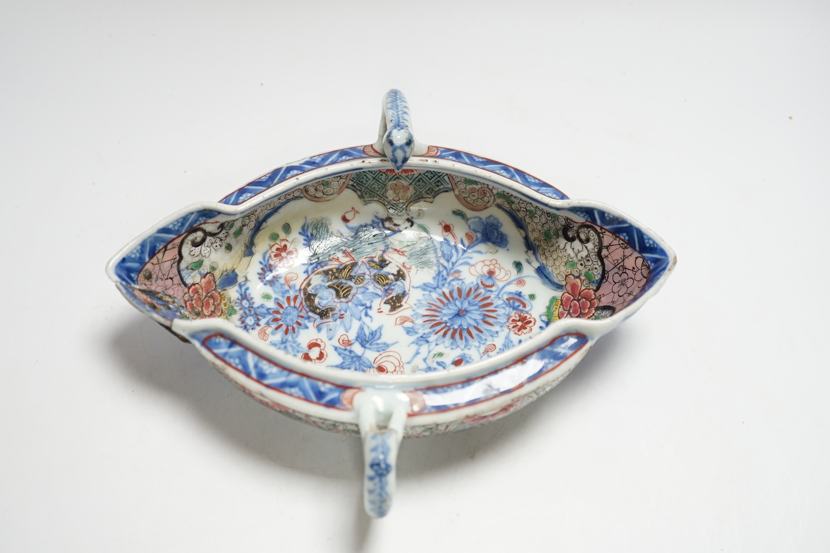 A Chinese clobbered blue and white double lipped sauceboat, Qianlong period, 23cm high